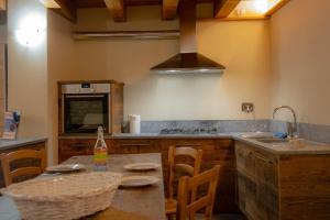 Kuchyňa alebo kuchynka v ubytovaní Inn Aosta Apartments