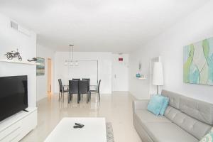 a living room with a couch and a table at Lovely Beach Apartment by Miami Te Espera- HOLLYWOOD 5U in Hollywood