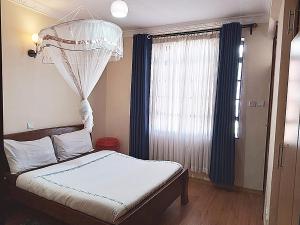 Postel nebo postele na pokoji v ubytování MANI HOMES