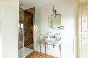 a bathroom with a sink and a shower at The Palm in Bray