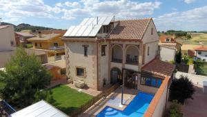 an aerial view of a house with a swimming pool at Casa Rural Figueroa in Jábaga