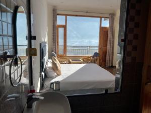 Katil atau katil-katil dalam bilik di Nomad Bed & Breakfast