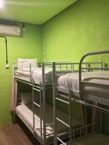 Una cama o camas en una habitación de Bandung Hostel