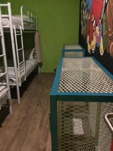 Una cama o camas en una habitación de Bandung Hostel