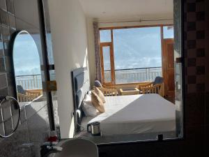 Katil atau katil-katil dalam bilik di Nomad Bed & Breakfast