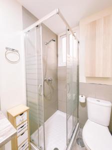 a bathroom with a shower and a toilet at Home Málaga in Málaga