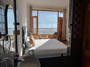 Katil atau katil-katil dalam bilik di Nomad Bed & Breakfast