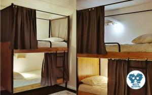 two bunk beds in a room with a mirror at Место встречи "Guest House Meeting place" in Bishkek