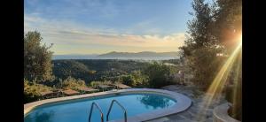 a swimming pool with a view of the mountains at Hikers Villa Trail 5 & 6 in Skiathos Town