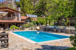a swimming pool in the backyard of a house at Sakin Vadi Villas in Marmaris