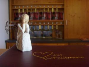 a figurine of a woman in a wedding dress on a table at Hotel & Restaurant Engel in Herbertingen