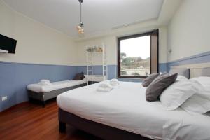 A bed or beds in a room at San Pietro Maison Még 26 kép