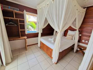 Postelja oz. postelje v sobi nastanitve Hotel Le Manguier