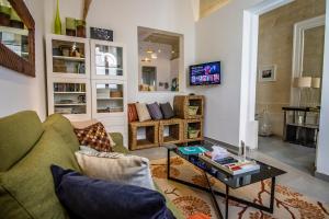 a living room with a couch and a table at 28 Peter in Sliema