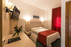 Postel nebo postele na pokoji v ubytování Hotel Ariston