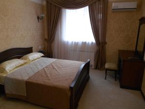 Tempat tidur dalam kamar di Yantar Hotel