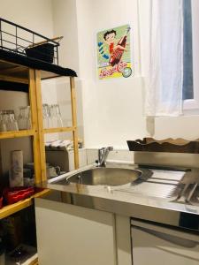 Kuchyňa alebo kuchynka v ubytovaní Habitation CASSIOPEE
