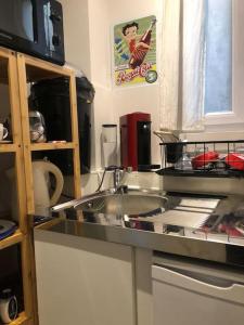 Kuchyňa alebo kuchynka v ubytovaní Habitation CASSIOPEE