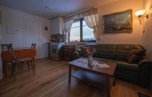 a living room with a couch and a table at Sanns villa in Lillehammer