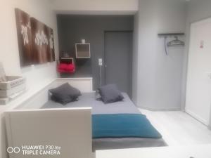 a rendering of a bedroom with a bed in a room at Petit nid douillet in Reventin-Vaugris +5 photos