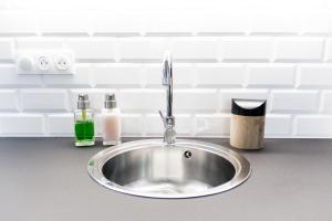a kitchen sink with a faucet on a counter at Easy Location - Parking - Free Wifi - Tourism and Business in Freyming