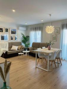 a living room with a couch and a table at BAEZA GOLDEN in Baeza