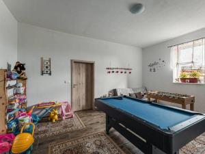 a living room with a pool table in it at Privat na Vŕšku in Ždiar