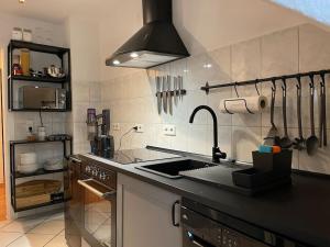 a kitchen with a sink and a stove at SPLENDiD: ☆Vintageflat In Center☆ in Hannover