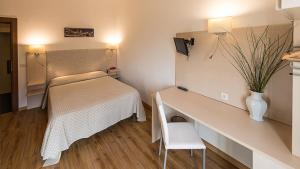 Postel nebo postele na pokoji v ubytování Hotel Ariston