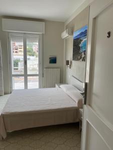 Postel nebo postele na pokoji v ubytování Casa Tacconi