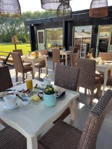 a table and chairs with food on a patio at Nenquen Lodge in Santa Cruz