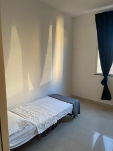 Ένα ή περισσότερα κρεβάτια σε δωμάτιο στο PALAZZO MAZZINI 1