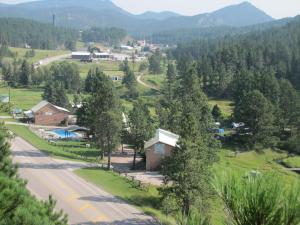 a small town in the mountains with a road at Black Hills Motel at Quail's Crossing in Hill City