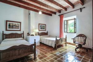 Postel nebo postele na pokoji v ubytování Villa Guillo