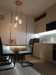 Kuchyňa alebo kuchynka v ubytovaní Apartament Zielone Wzgórze 2