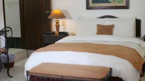 Cama o camas de una habitación en Hotel Camino Maya
