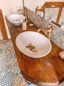 a bathroom with a sink in a wooden counter at .... chillout między Łodzią a Warszawą in Nieborów