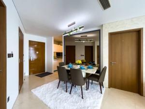 a dining room with a table and chairs at The Luxury Penthouses Kuala Lumpur in Kuala Lumpur