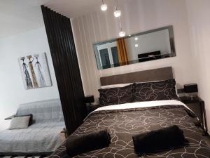 a bedroom with a bed and a mirror at Stefan 1 in Umag