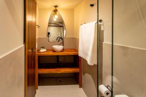a bathroom with a sink and a mirror at Casa Savana in São Paulo +20 photos