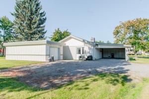 a house with a garage and a driveway at Spacious Villa located in Beautiful High Coast in Domsjö