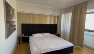 Un pat sau paturi într-o cameră la apartment 26 old town