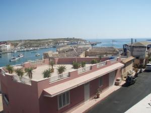 a view from the balcony of a building with a marina at Bivani sul porto vecchio in Lampedusa