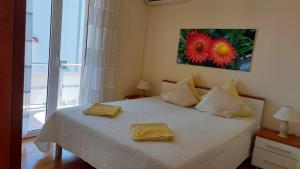 Postel nebo postele na pokoji v ubytování Apartments Jelica