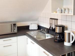 Кухня или мини-кухня в Ferienwohnung Uni Koblenz
