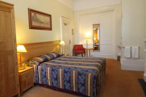 En eller flere senge i et værelse på Grange Lancaster Hotel
