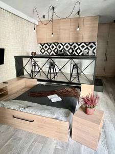 a room with a bed and a table in it at Smart Apartment Ogrodowa in Warsaw