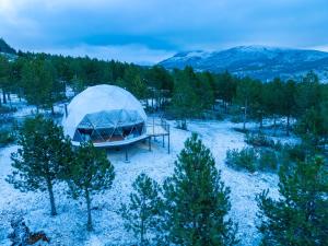 an aerial view of a tent in a field with trees at Continental Adventure Resort - Mountain Escape & Glamping in Livno
