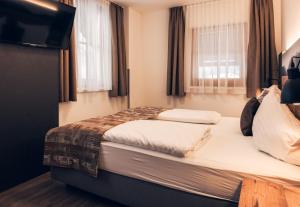 Łóżko lub łóżka w pokoju w obiekcie Ferienwohnung Nassfeld