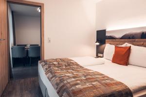 Łóżko lub łóżka w pokoju w obiekcie Ferienwohnung Nassfeld